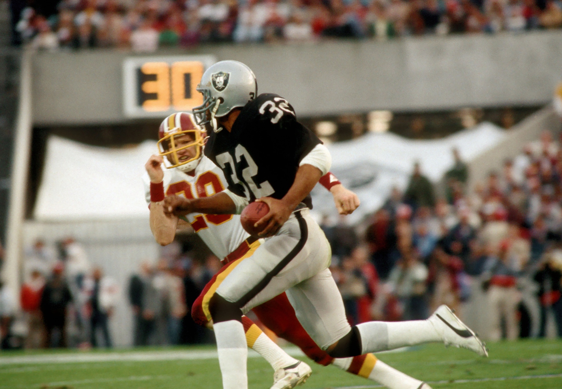 Marcus Allen and Ronnie Lott